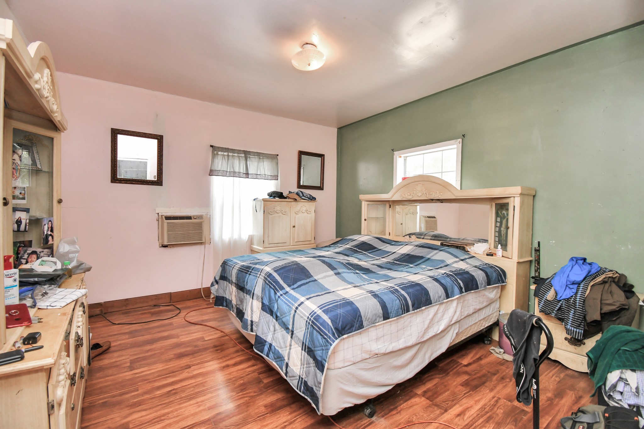 7908 John Street Houston, TX 77012 - Photo 16 of 30 a bedroom with a bed and wooden floor