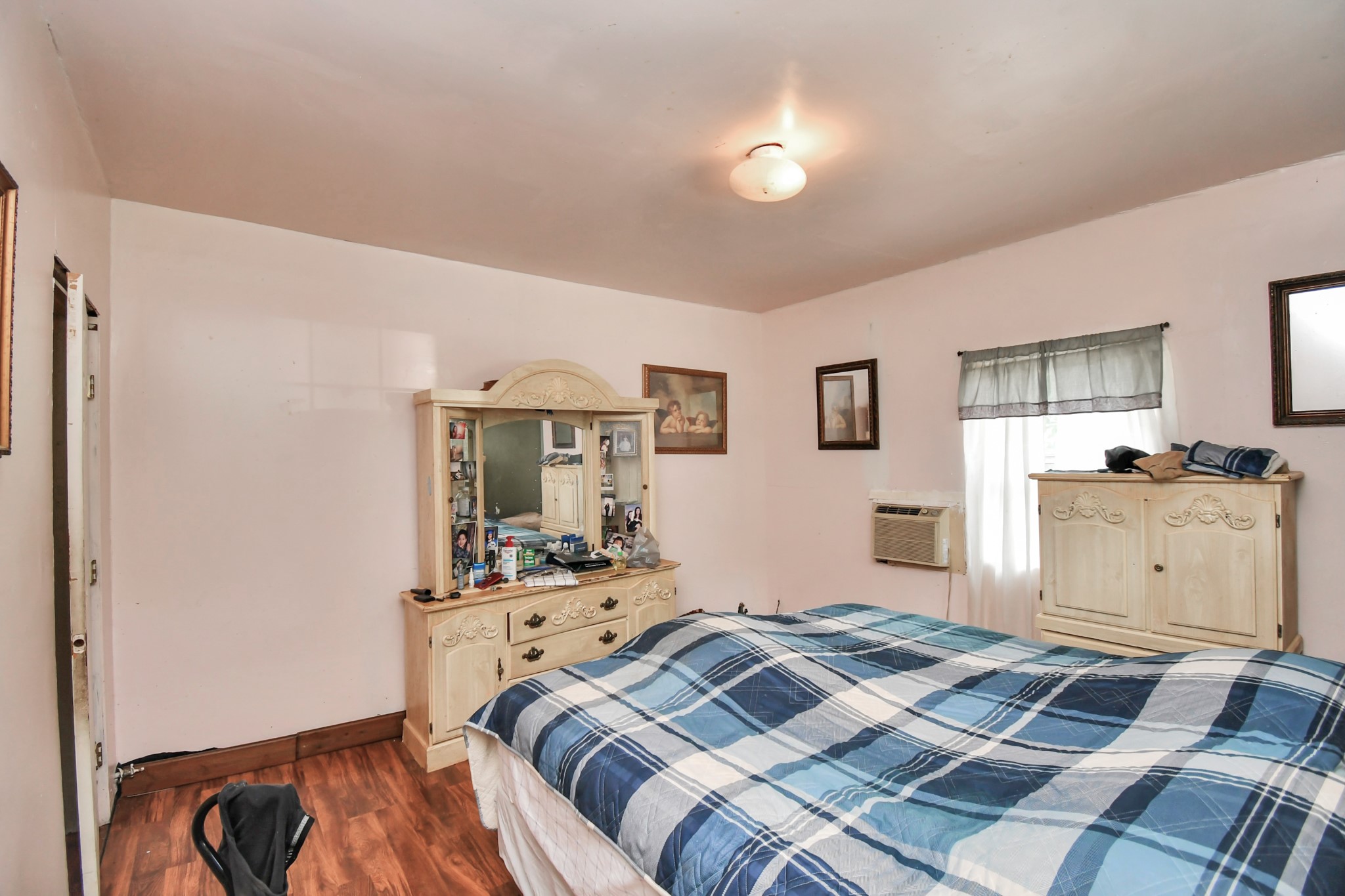 7908 John Street Houston, TX 77012 - Photo 17 of 30 a bedroom with a bed and a view of kitchen
