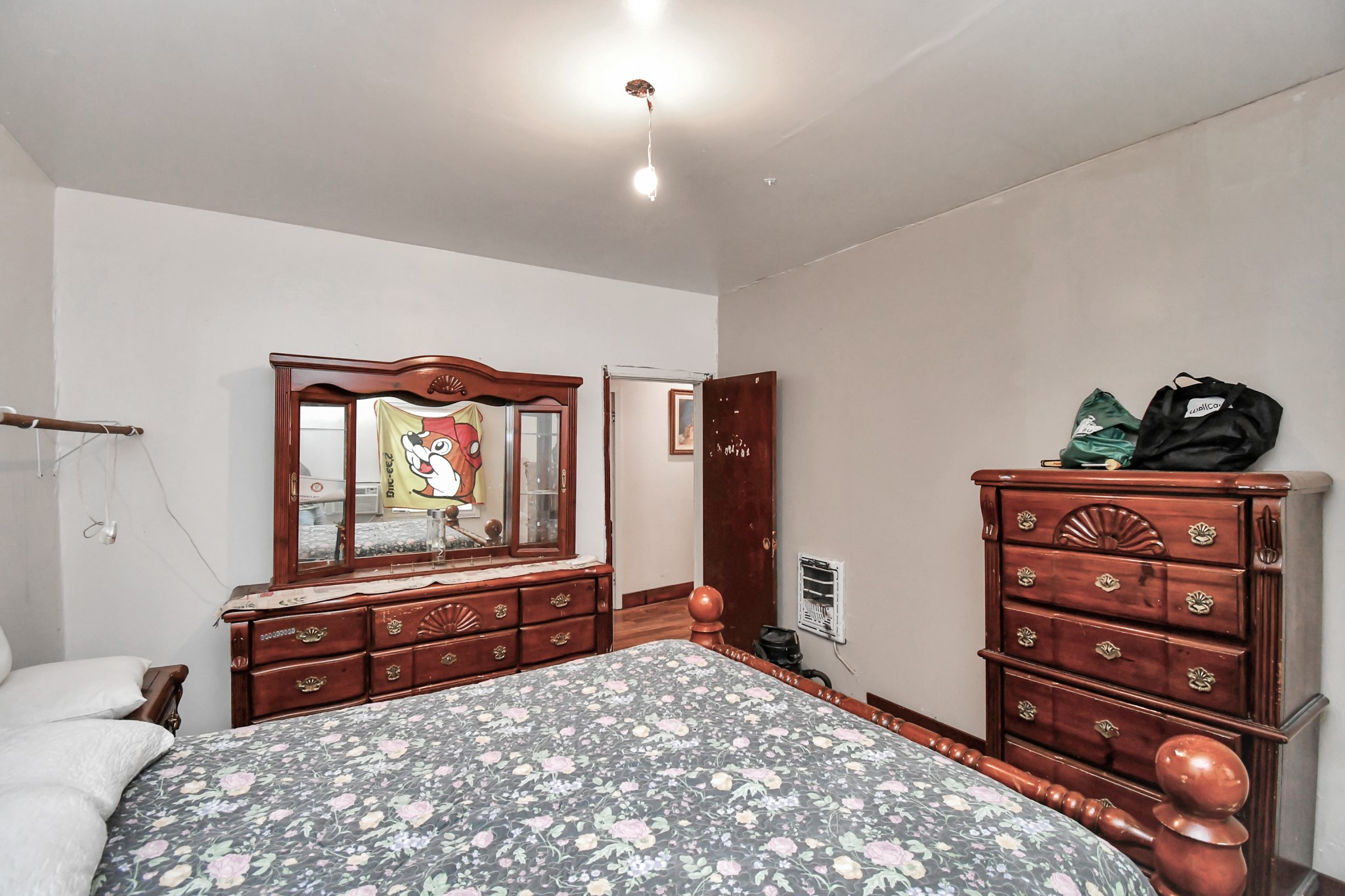 7908 John Street Houston, TX 77012 - Photo 27 of 30 a bedroom with a bed and a dresser