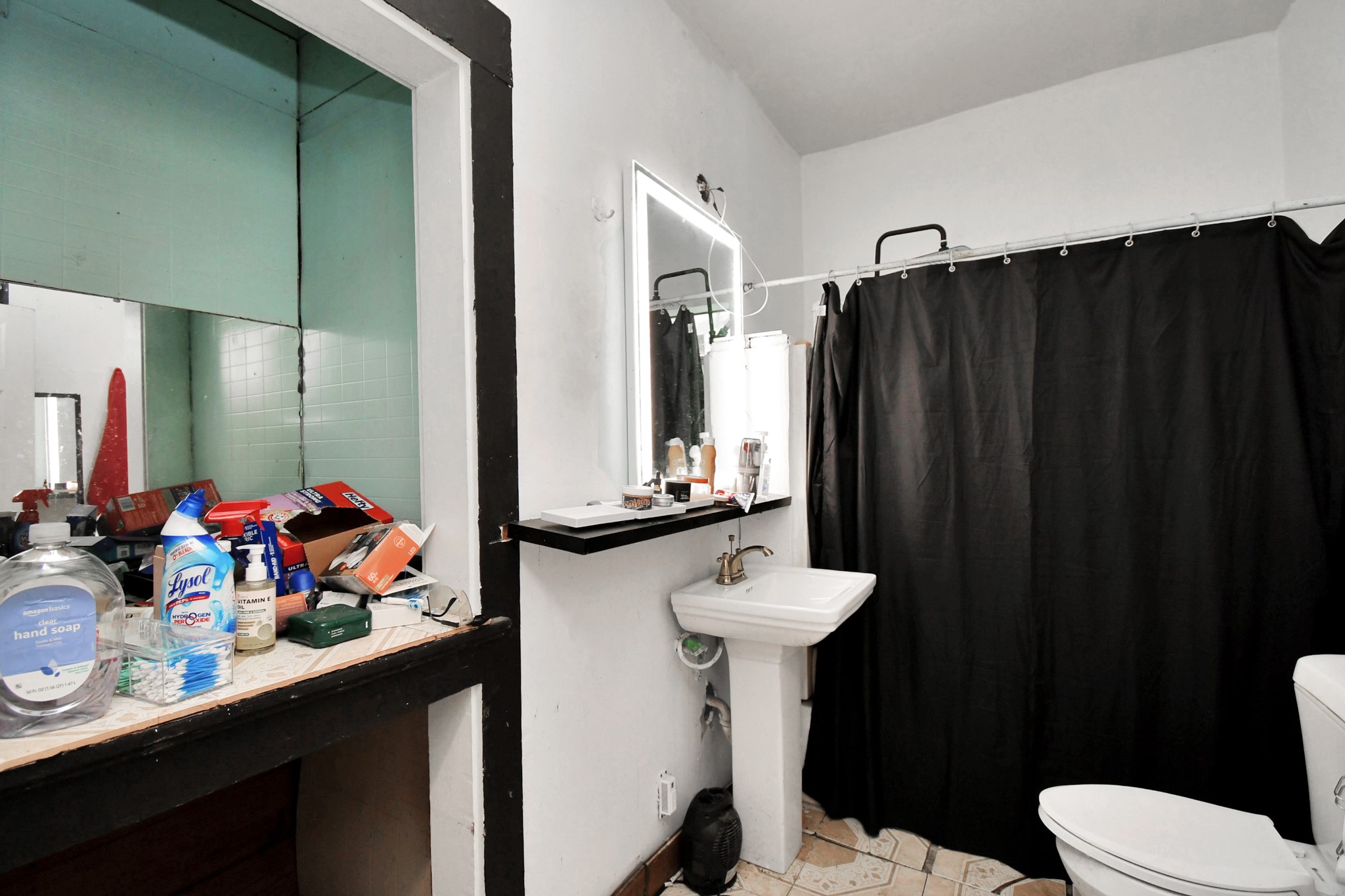 7908 John Street Houston, TX 77012 - Photo 28 of 30 a bathroom with a sink mirror toilet and shower