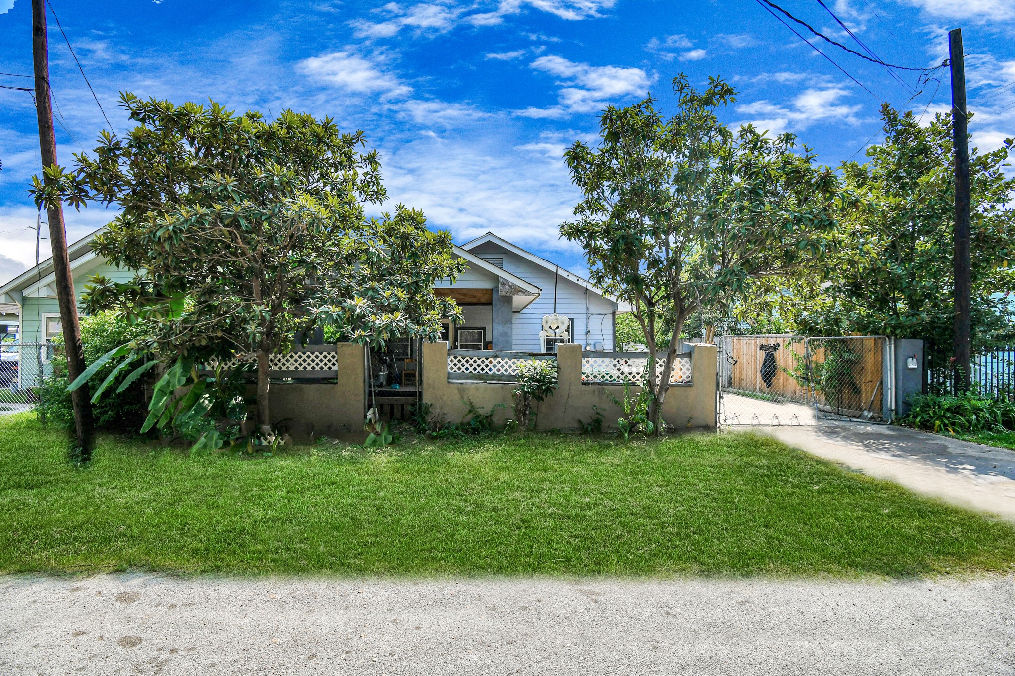 7908 John Street Houston, TX 77012 - Photo 3 of 30 a front view of a house with garden