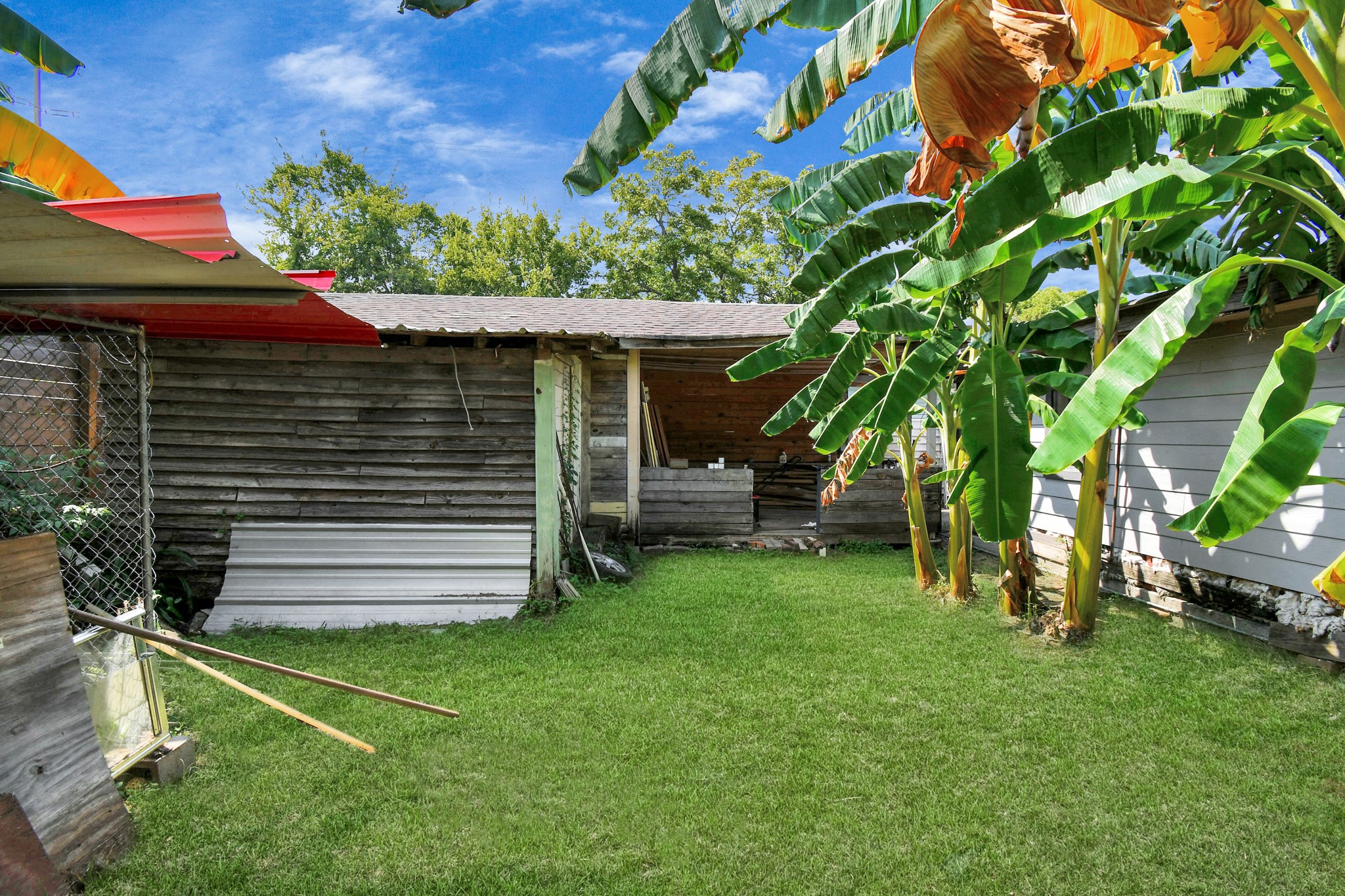7908 John Street Houston, TX 77012 - Photo 6 of 30 a front view of a house with a garden