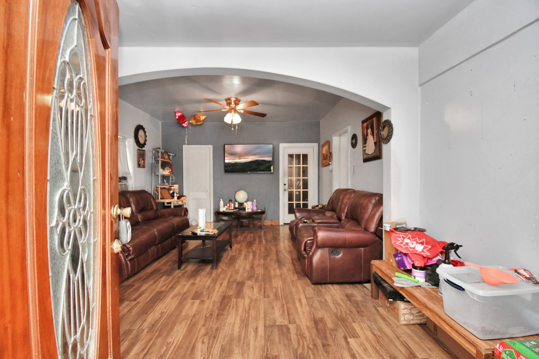 7908 John Street Houston, TX 77012 - Photo 10 of 30 a living room with furniture and a chandelier