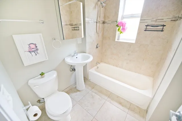a bathroom with a sink toilet and bathtub