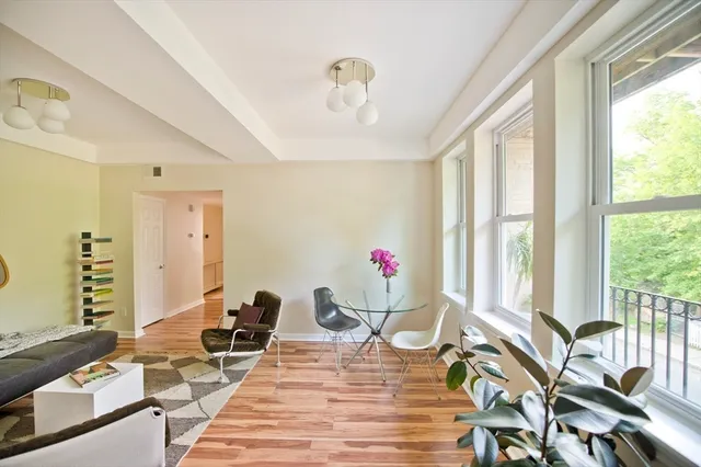 a very nice looking dining room with a large window