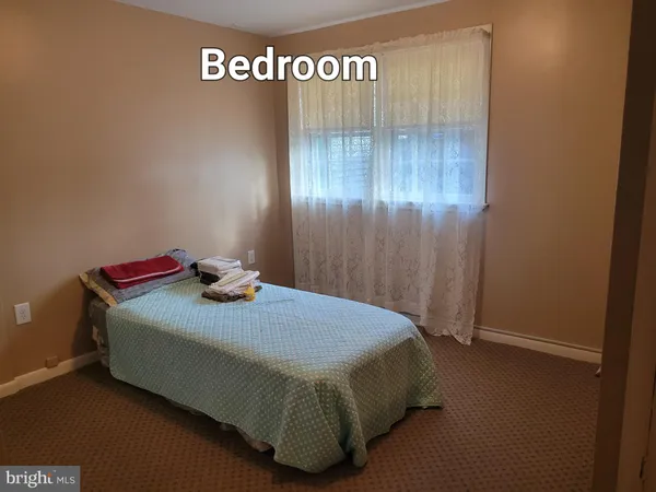 a bedroom with a bed and a table
