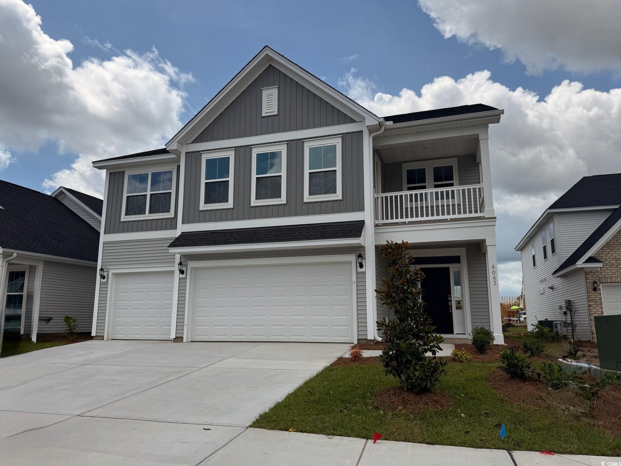 4043 Bucolic Loop Myrtle Beach, SC 29588 - Photo 1 of 25 View of front facade featuring board and batten si