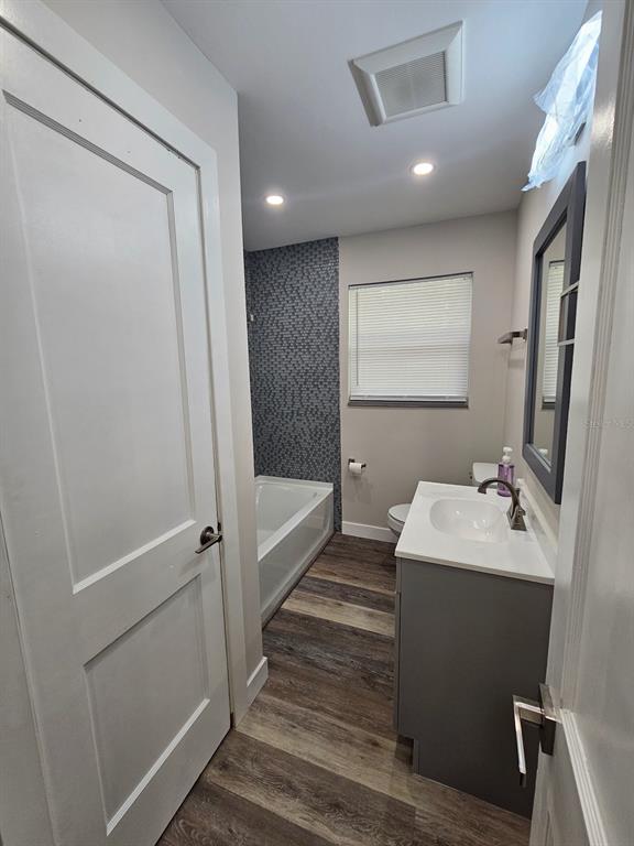 903 Northwest 33rd Avenue Gainesville, FL 32609 - Photo 13 of 23 a bathroom with a sink toilet and shower