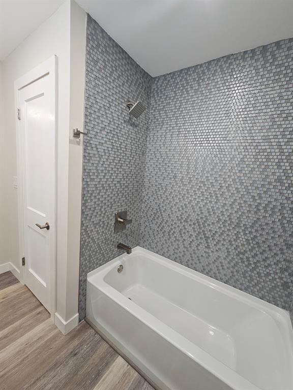 903 Northwest 33rd Avenue Gainesville, FL 32609 - Photo 14 of 23 a bathroom with a bathtub
