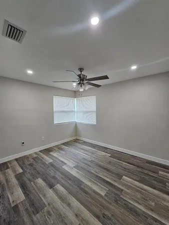 a view of an empty room with a window