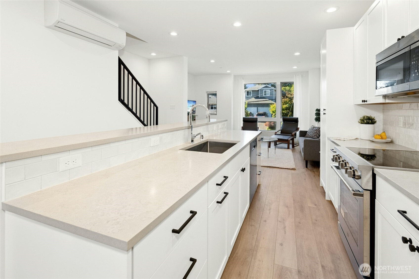 18512 Wallingford Avenue North Shoreline, WA 98133 - Photo 11 of 32 a kitchen with sink a stove and cabinets