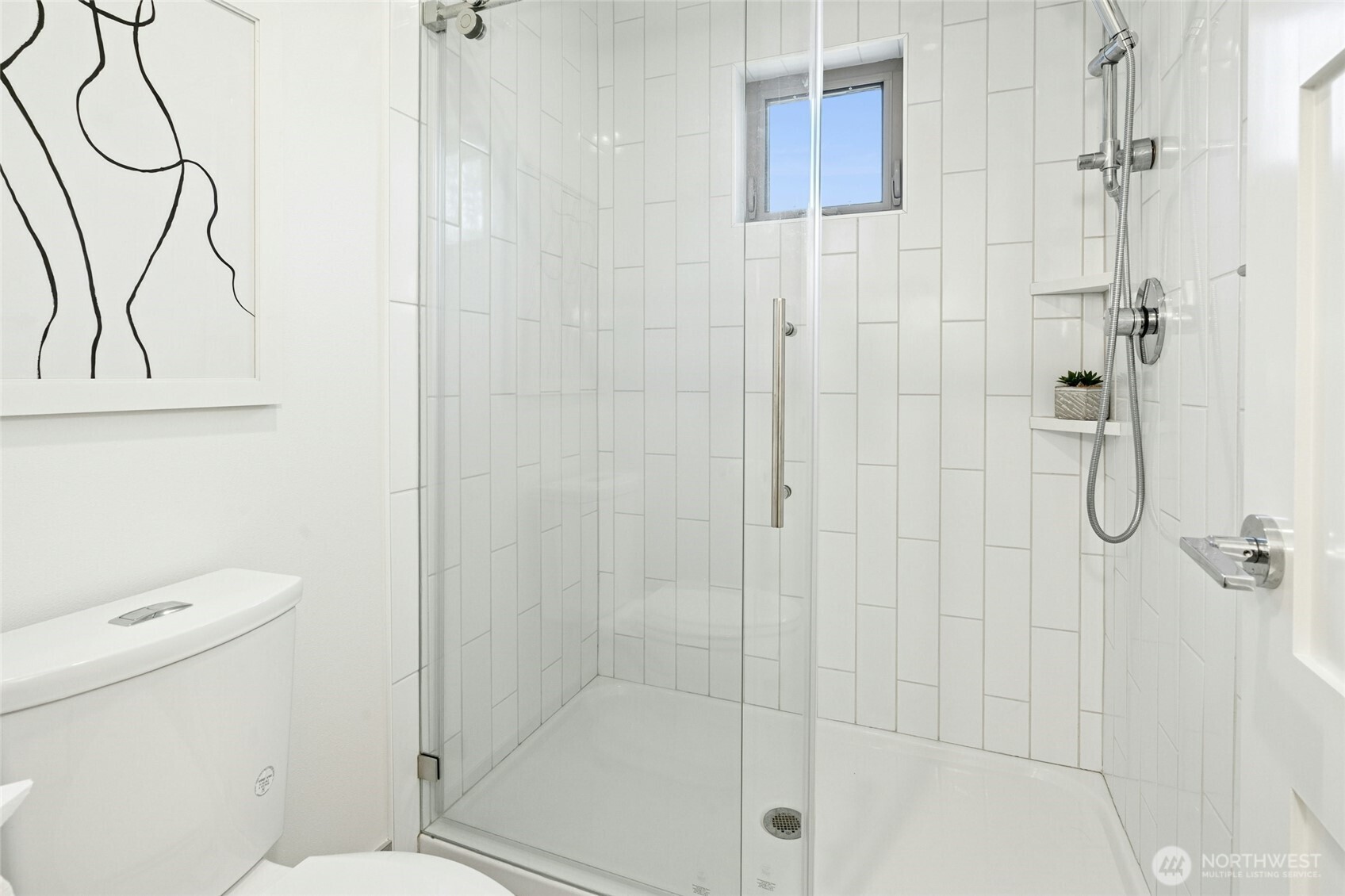 18512 Wallingford Avenue North Shoreline, WA 98133 - Photo 21 of 32 a bathroom with a shower a toilet and a shower