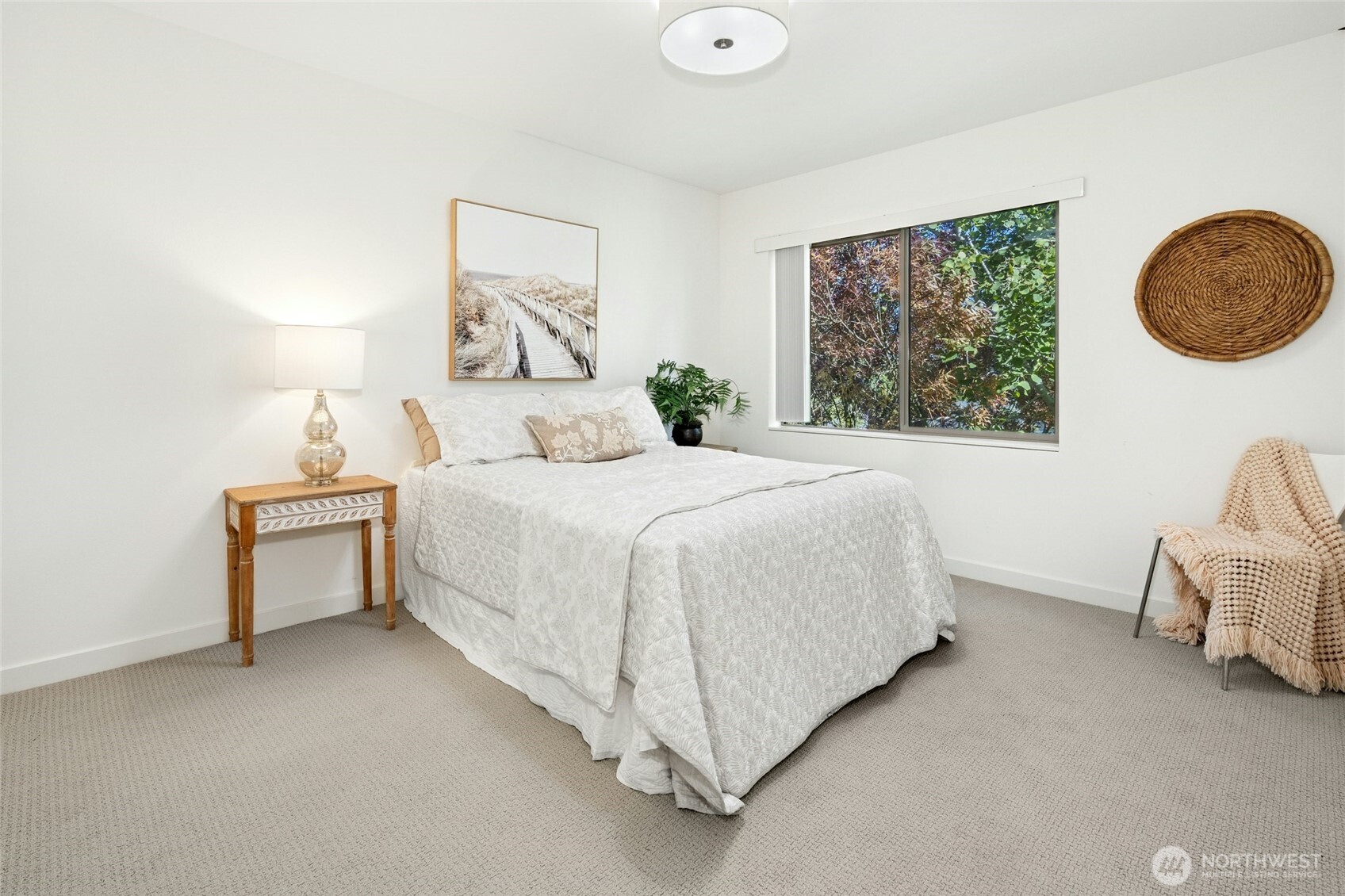 18512 Wallingford Avenue North Shoreline, WA 98133 - Photo 22 of 32 a bedroom with a bed and a painting on the wall