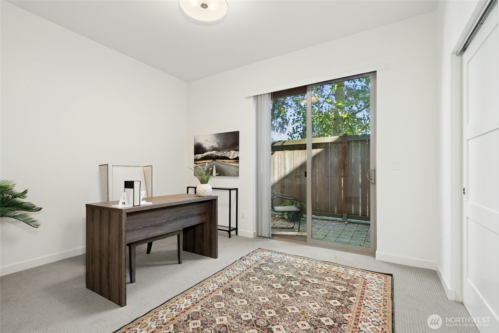 18512 Wallingford Avenue North Shoreline, WA 98133 - Photo 26 of 32 a view of a workspace with furniture and a window