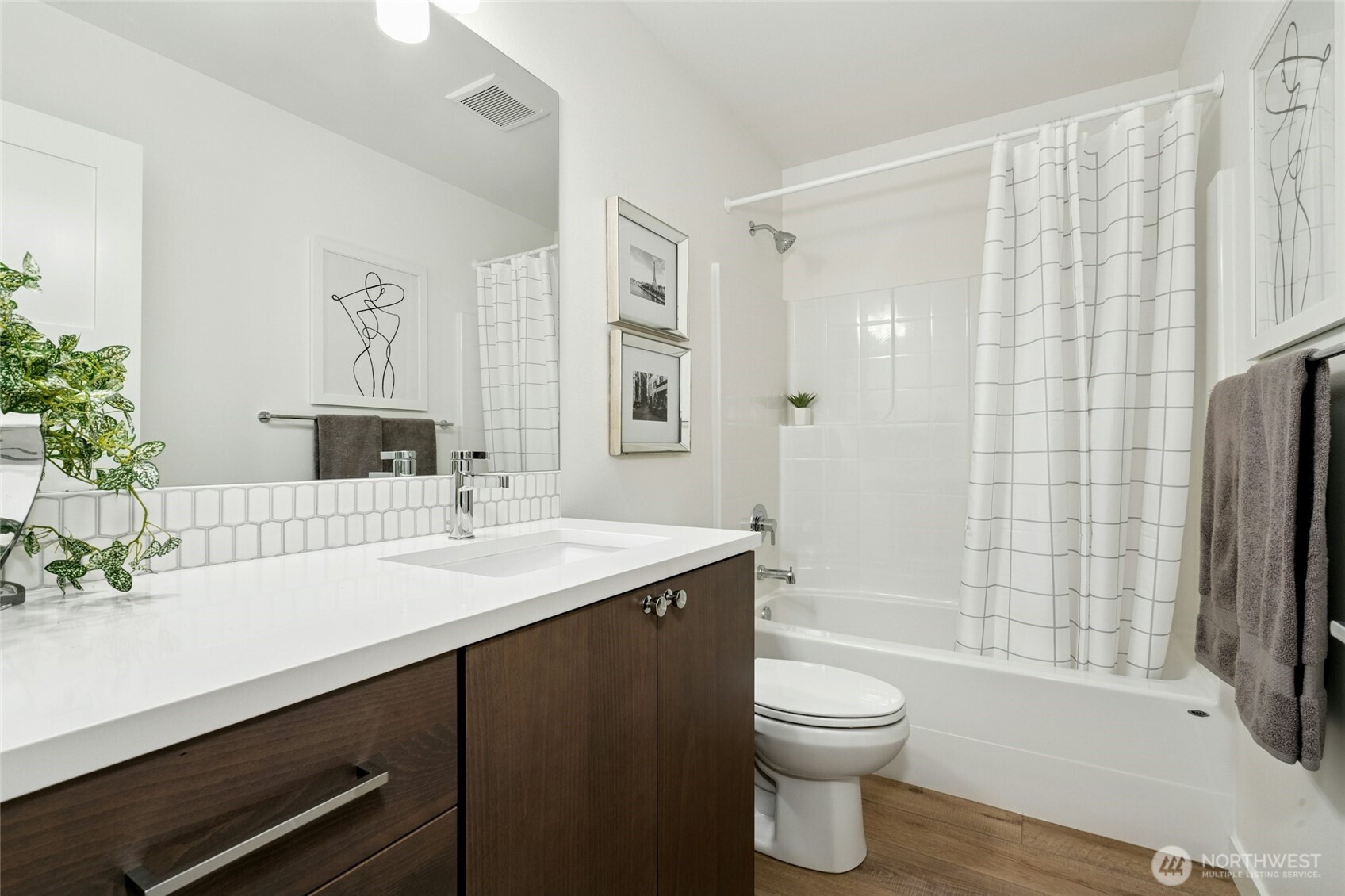18512 Wallingford Avenue North Shoreline, WA 98133 - Photo 27 of 32 a bathroom with a sink a toilet and shower