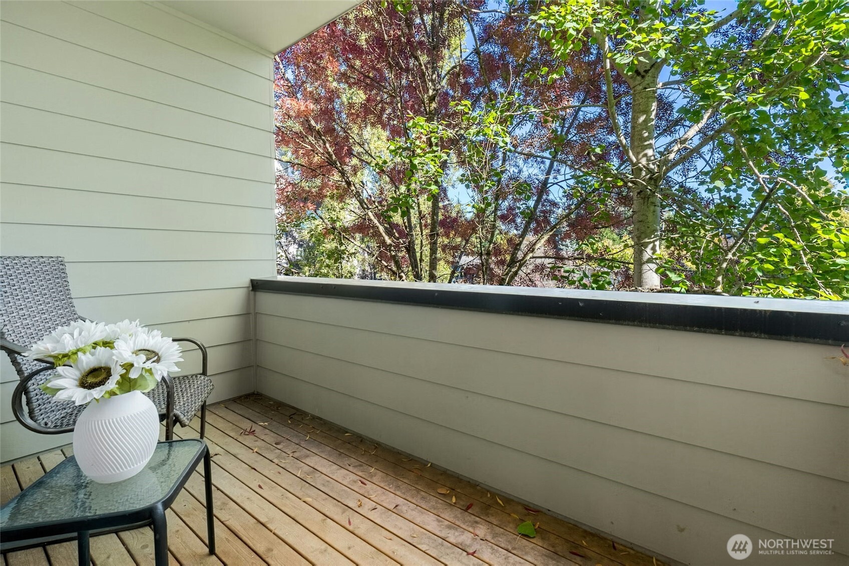 18512 Wallingford Avenue North Shoreline, WA 98133 - Photo 28 of 32 a view of a balcony with a chair and a potted plant