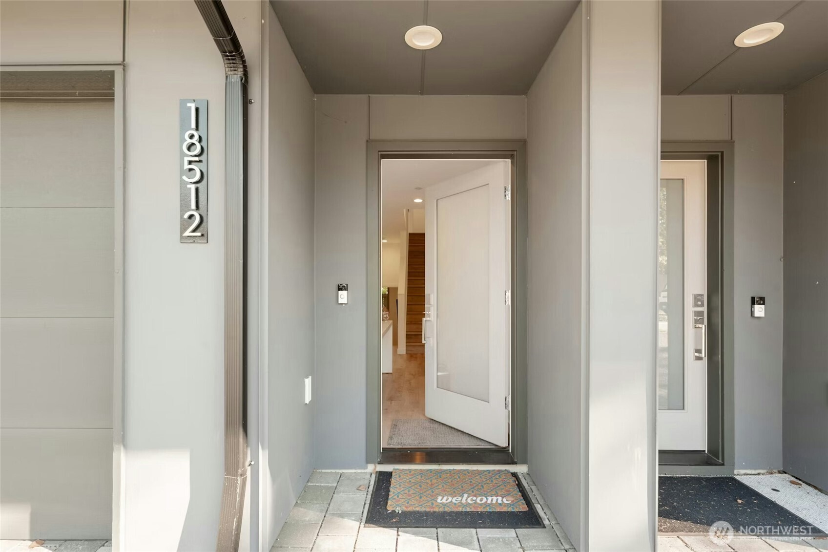 18512 Wallingford Avenue North Shoreline, WA 98133 - Photo 3 of 32 a view of a hallway with a elevator