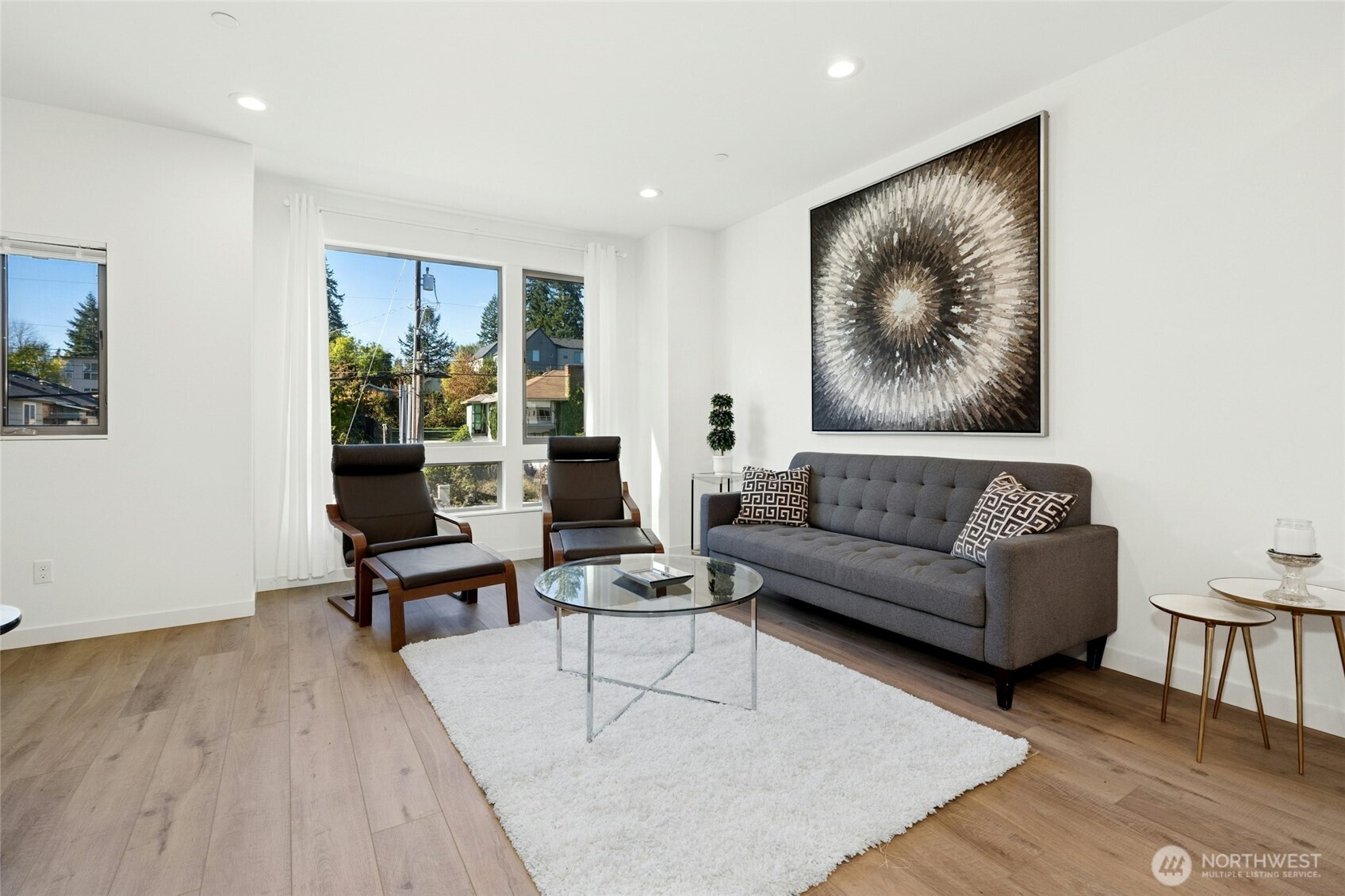 18512 Wallingford Avenue North Shoreline, WA 98133 - Photo 6 of 32 a living room with furniture and a painting on the wall