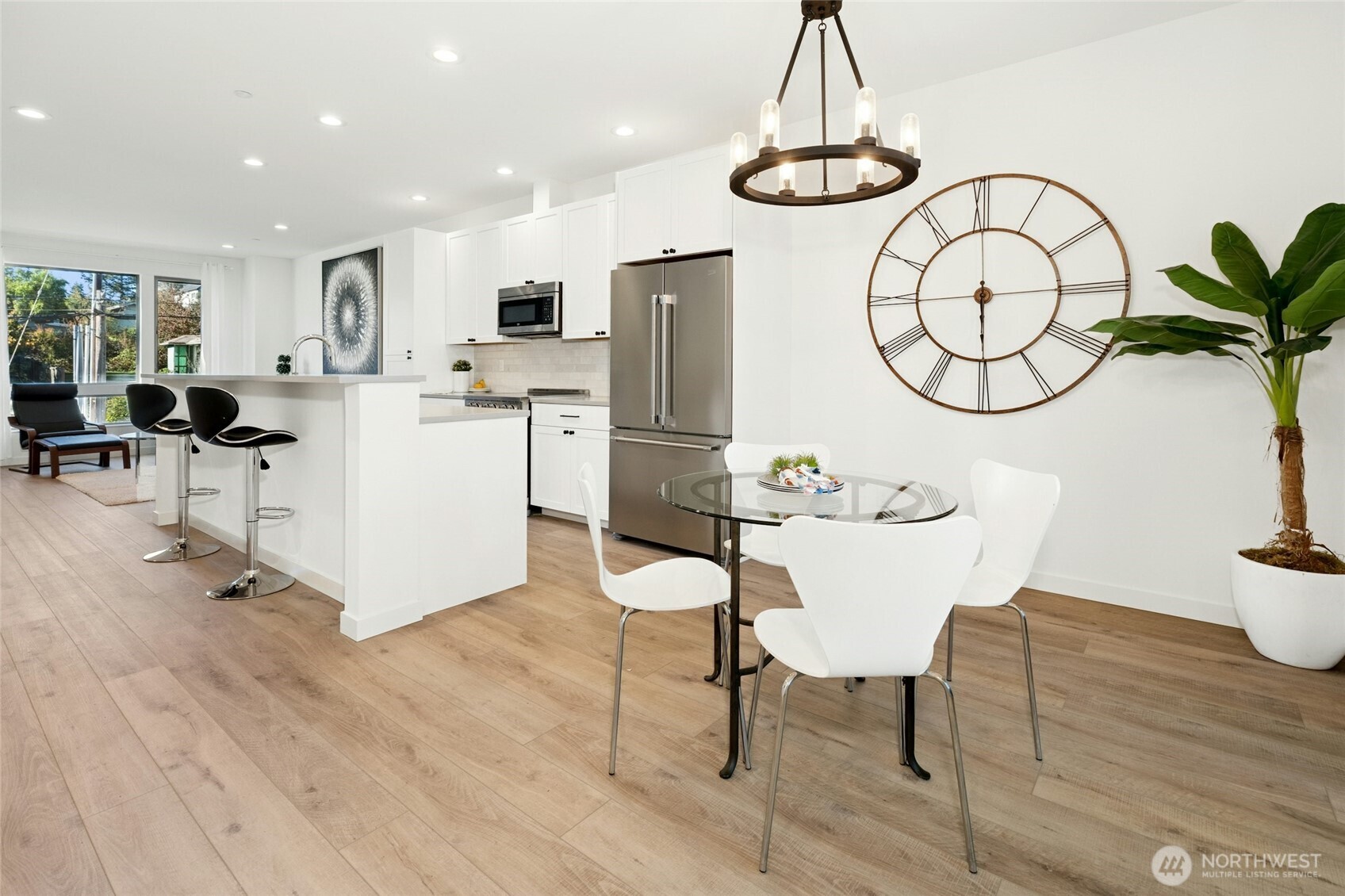 18512 Wallingford Avenue North Shoreline, WA 98133 - Photo 8 of 32 a view of kitchen with dining table and chairs