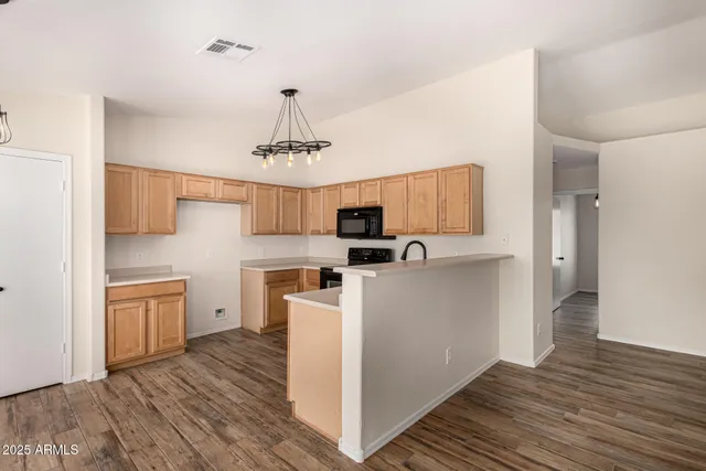 a view of a kitchen with electric appliances