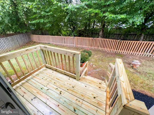 a view of balcony with wooden floor