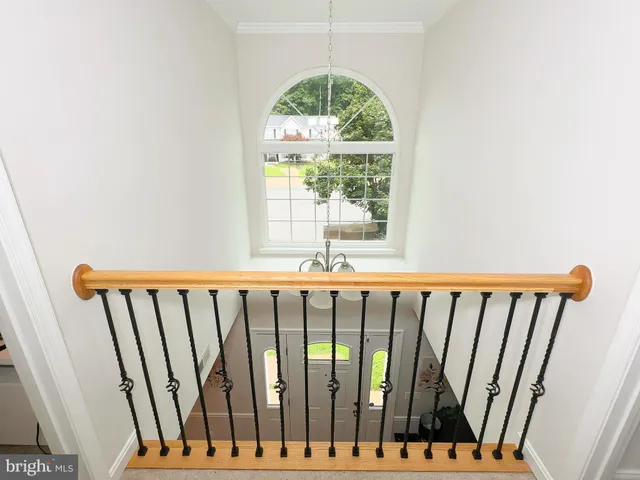 a view of staircase with window