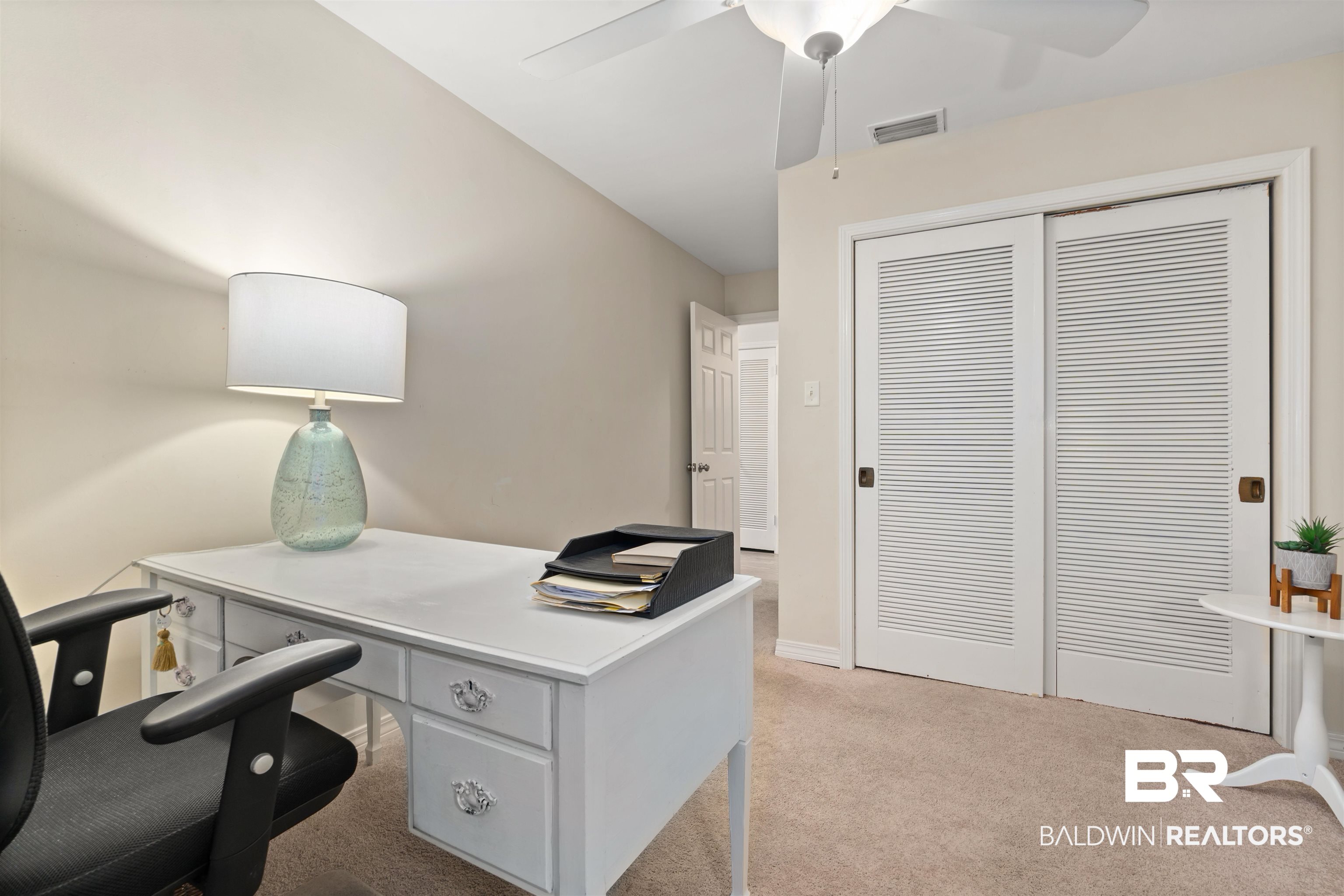 4051 East Canal Circle Mobile, AL 36619 - Photo 21 of 32 Bedroom featuring light carpet and ceiling fan