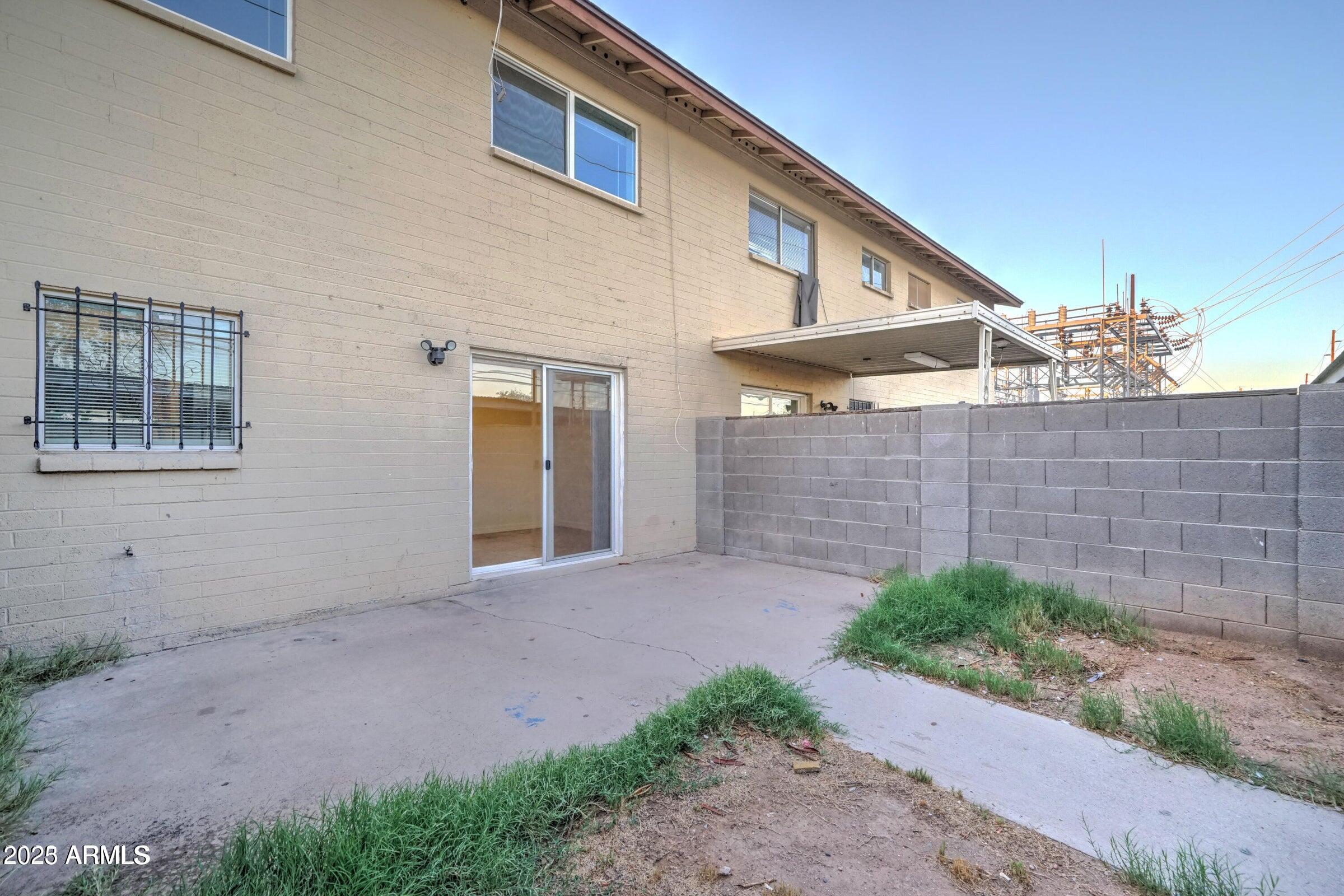 3605 West Bethany Home Road, Unit 17 Phoenix, AZ 85019 - Photo 13 of 13 a front view of a house with a yard