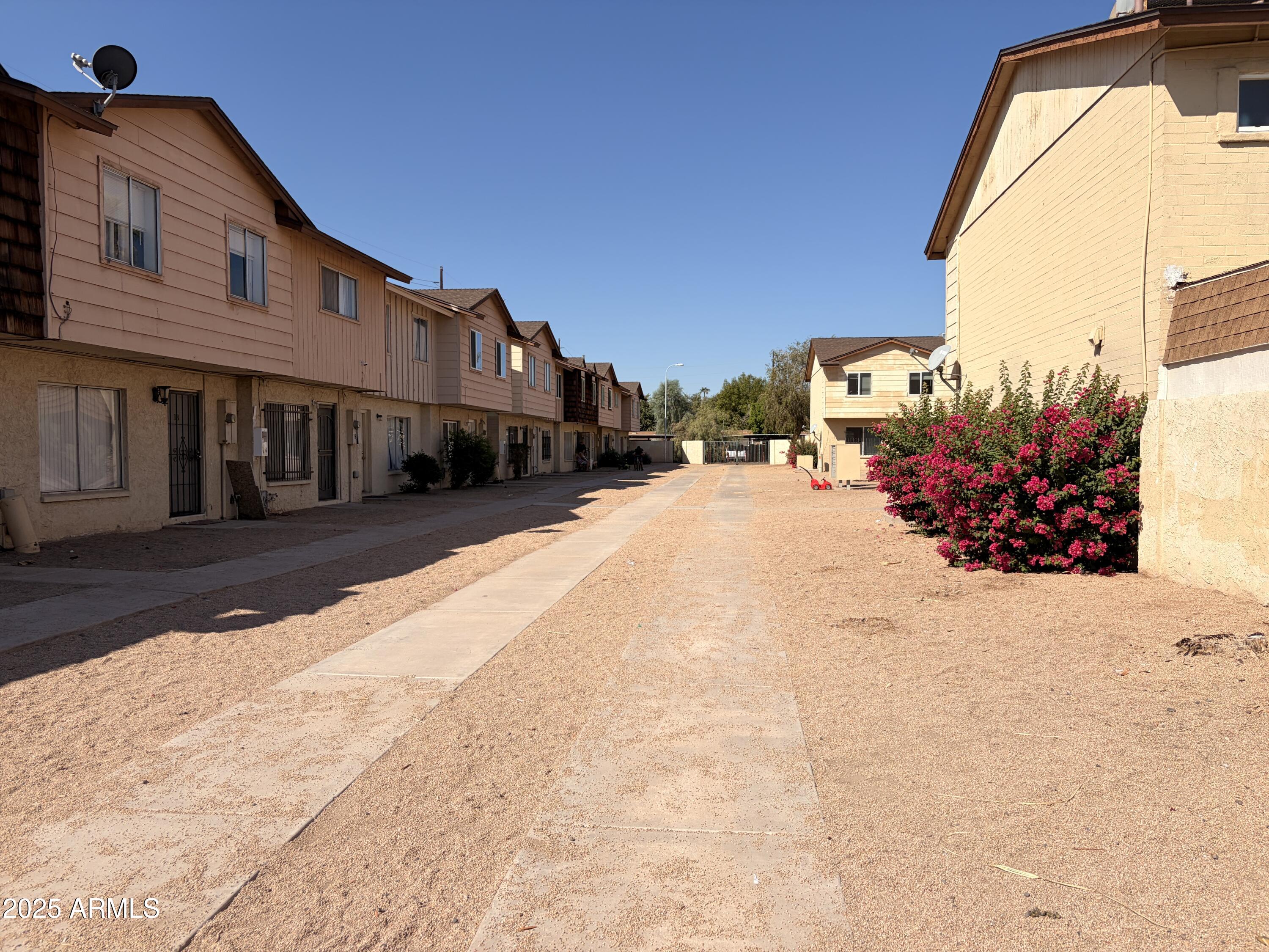 3605 West Bethany Home Road, Unit 17 Phoenix, AZ 85019 - Photo 2 of 13 a view of a house with a snow in the yard