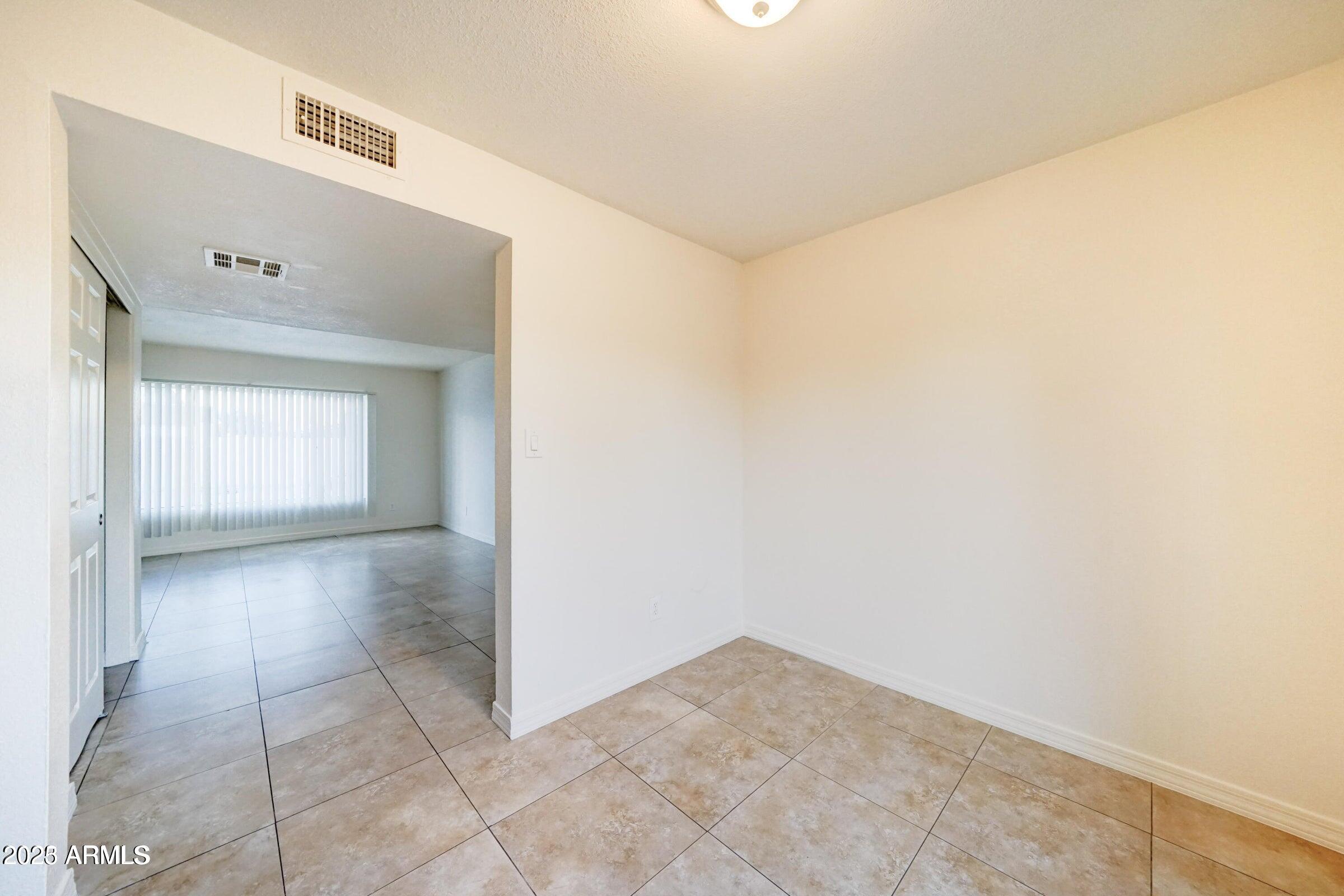 3605 West Bethany Home Road, Unit 17 Phoenix, AZ 85019 - Photo 6 of 13 a view of an empty room