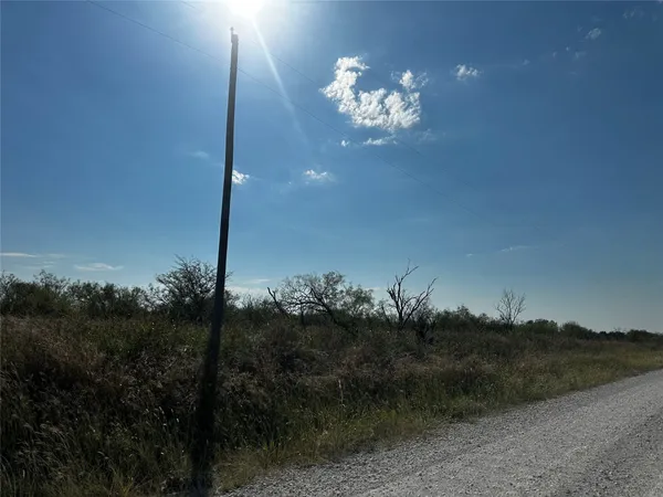 a view of a balcony with a table and chairs