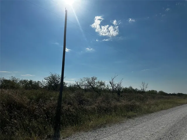 a view of a balcony with a table and chairs