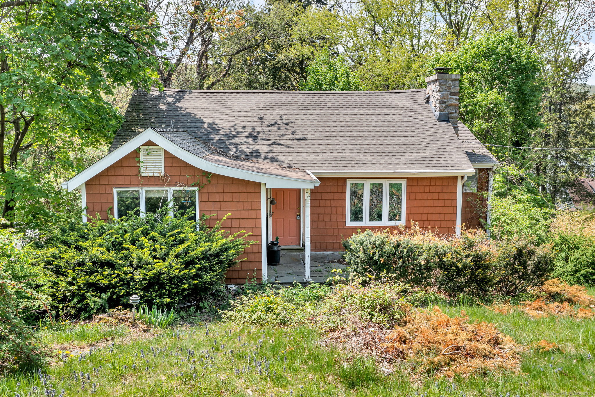 front view of a house with a yard