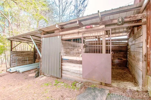 a view of a house with a wooden fence