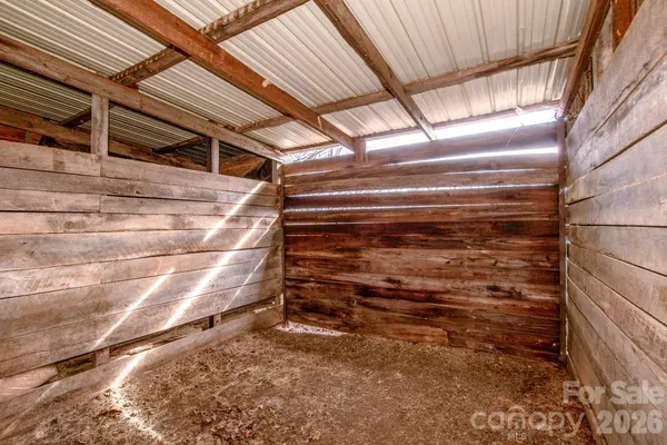 a view of backyard with outdoor seating and plants
