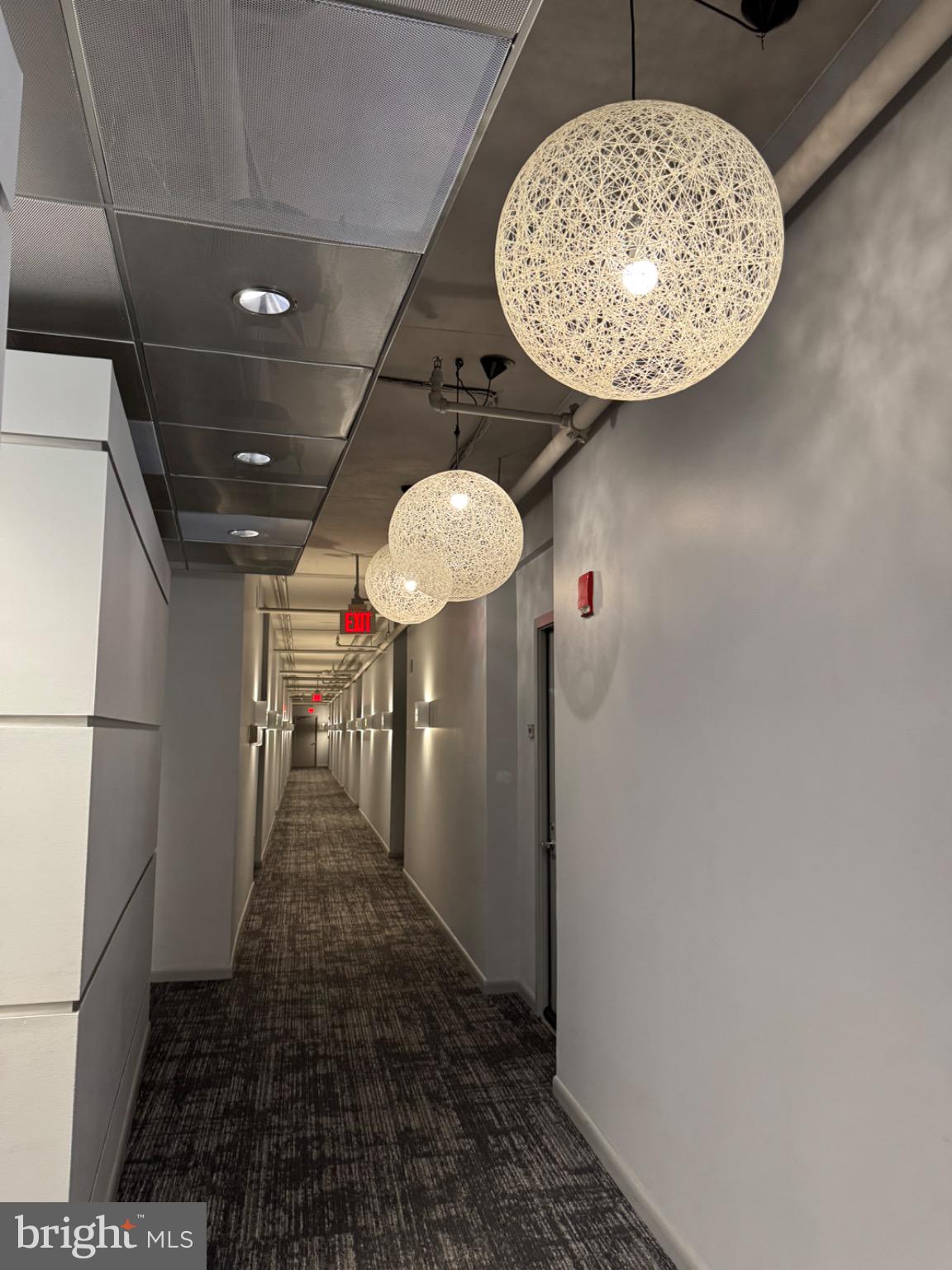 1300 N Street Northwest, Unit 21 Washington, DC 20005 - Photo 10 of 21 a view of a hallway with a chandelier