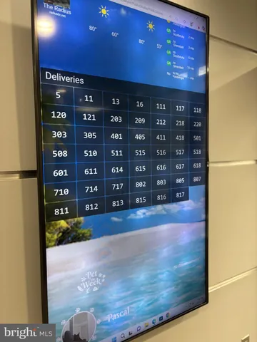 a view of a hallway with a chandelier