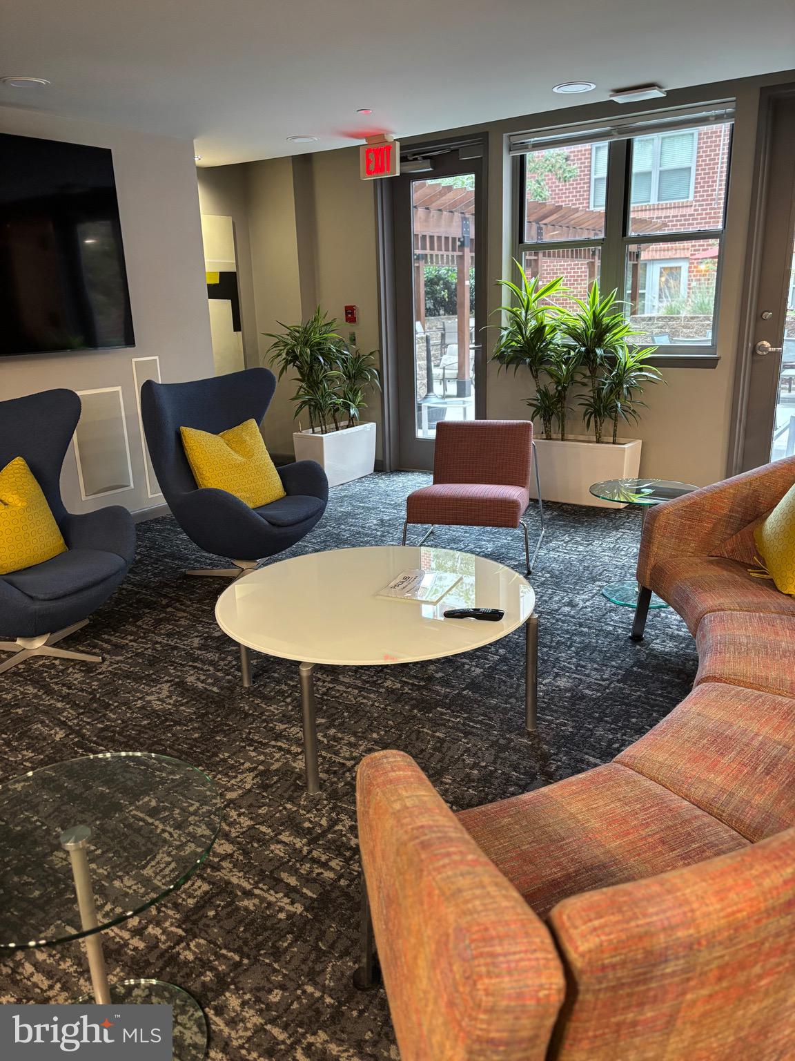 1300 N Street Northwest, Unit 21 Washington, DC 20005 - Photo 16 of 21 a living room with furniture and a table