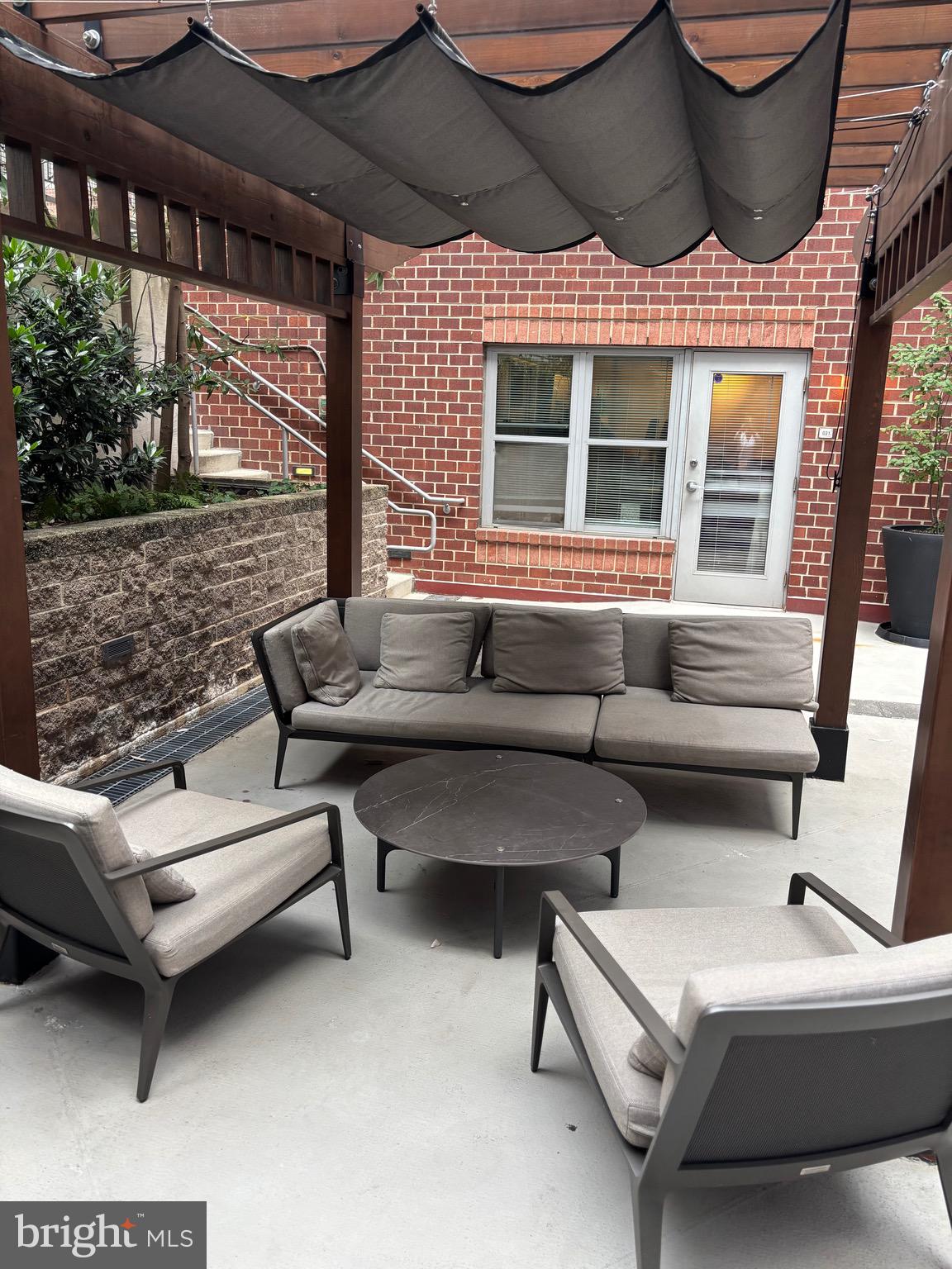 1300 N Street Northwest, Unit 21 Washington, DC 20005 - Photo 22 of 27 a building outdoor space with patio furniture