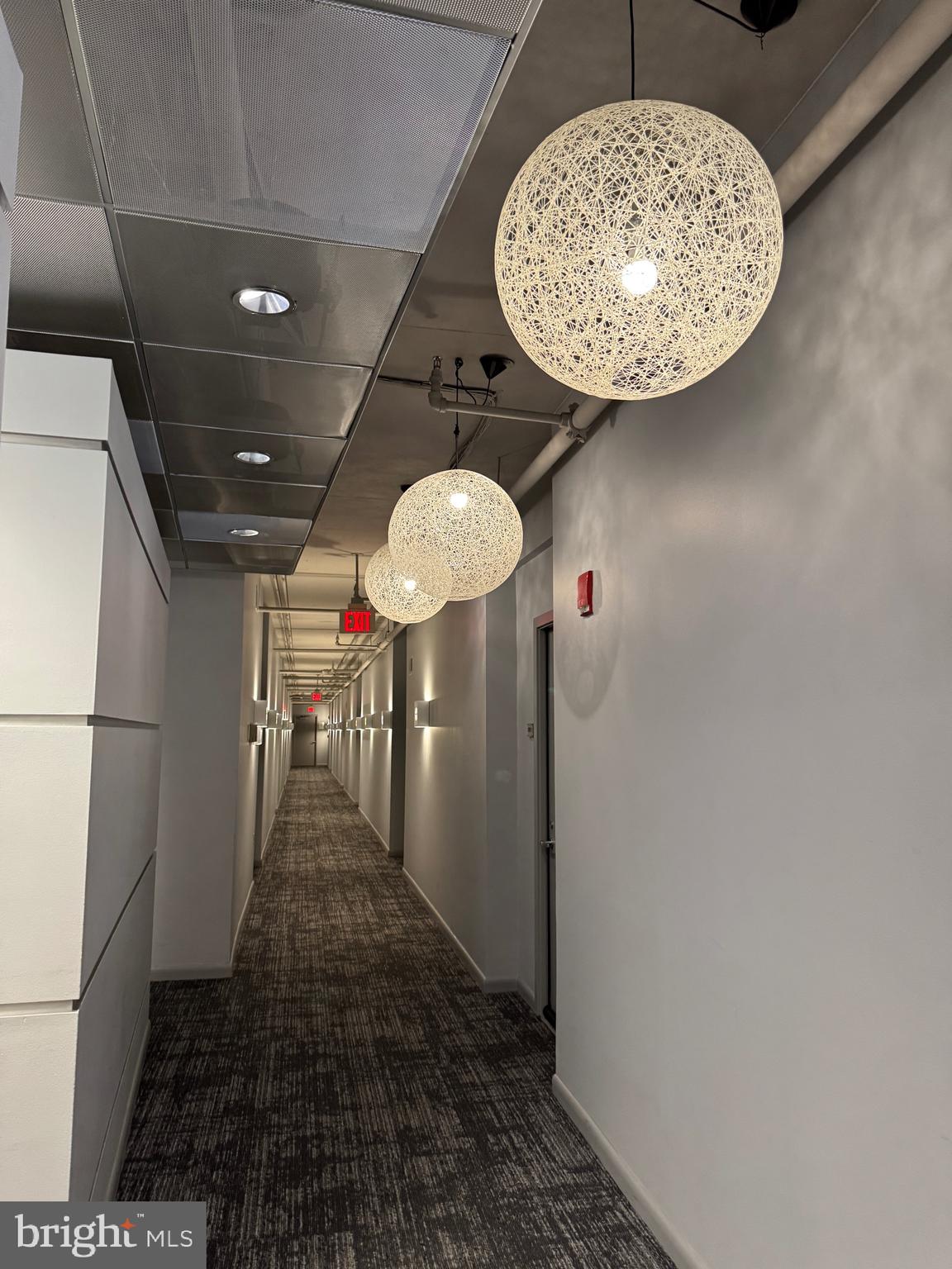 1300 N Street Northwest, Unit 21 Washington, DC 20005 - Photo 24 of 27 a view of a hallway with a chandelier