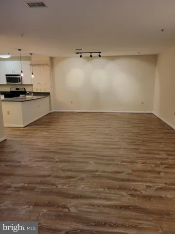 a living room with furniture and a lamp