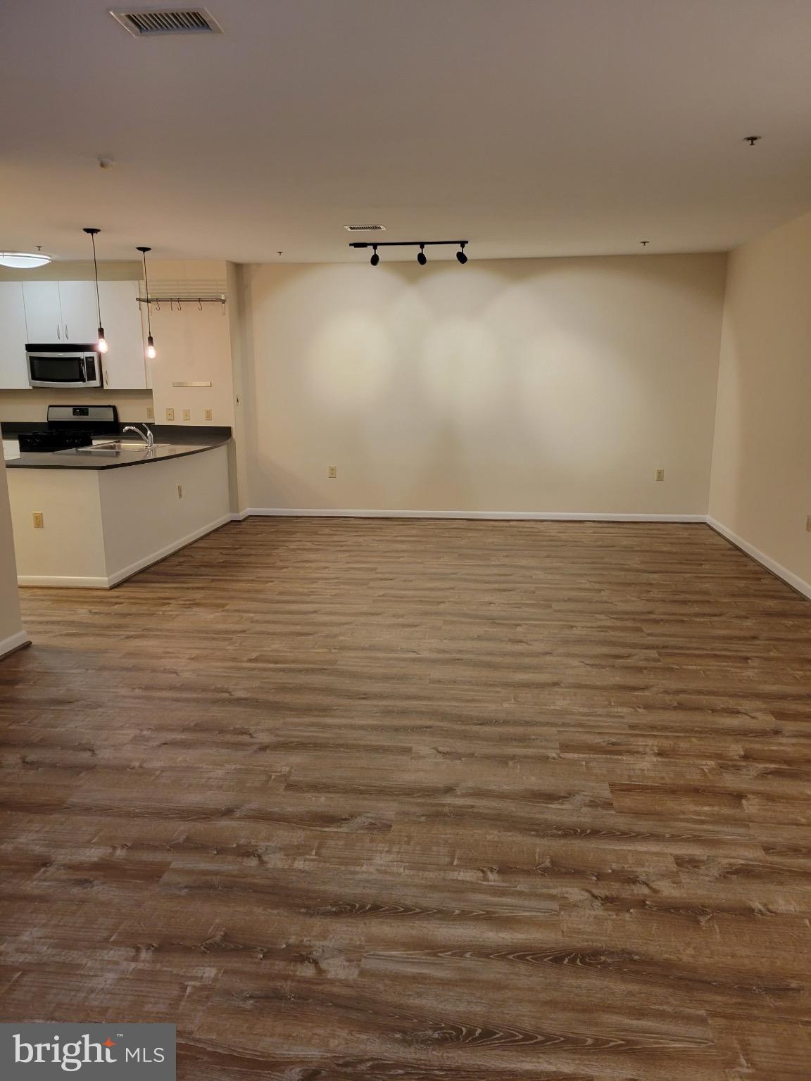 1300 N Street Northwest, Unit 21 Washington, DC 20005 - Photo 9 of 21 a view of a kitchen with an empty space