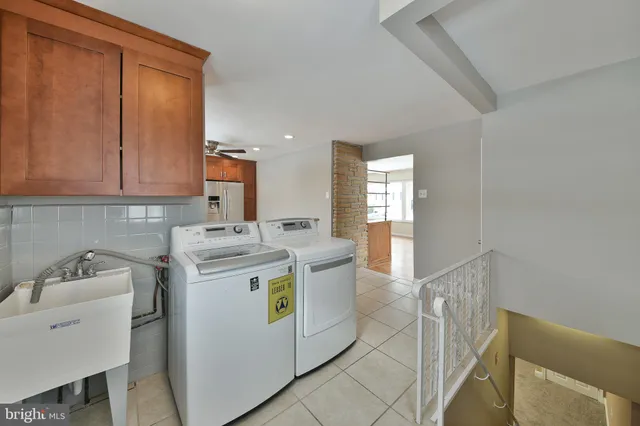 a utility room with dryer and washer