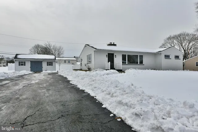 a large white bed in a white house