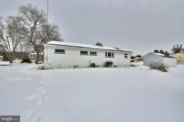 a couple of cars parked in front of house