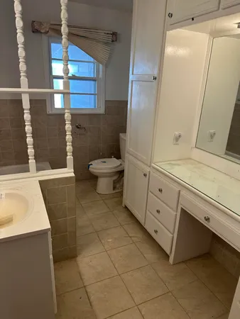 a bathroom with a sink and toilet