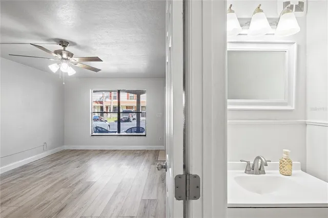a view of an entryway with wooden floor