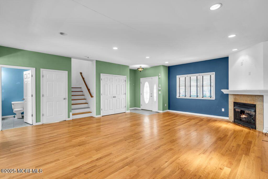 18 Stuyvesant Road Brick, NJ 08723 - Photo 5 of 29 a view of an empty room with wooden floor and a fireplace