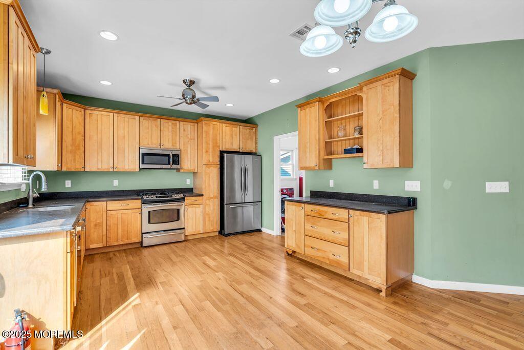 18 Stuyvesant Road Brick, NJ 08723 - Photo 9 of 29 a kitchen with stainless steel appliances granite countertop a refrigerator a sink dishwasher and a stove with wooden floor