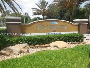 8781 Wiles Road, Unit 103 Coral Springs, FL 33067 - Photo 1 of 19 a view of swimming pool with a garden